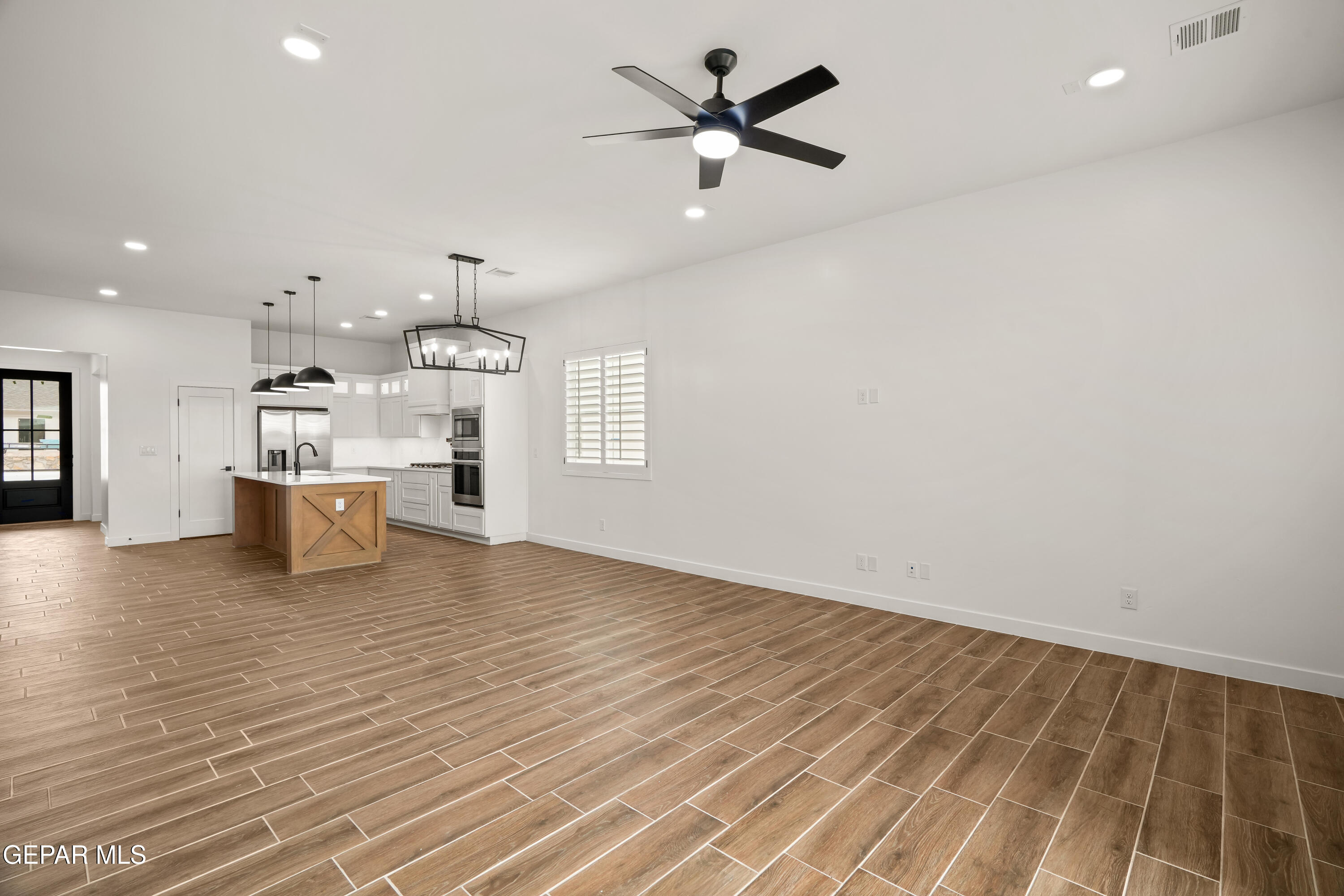 15212 Resolve Drive El Paso, TX 79938 - Photo 16 of 35 a view of a big room with wooden floor and windows