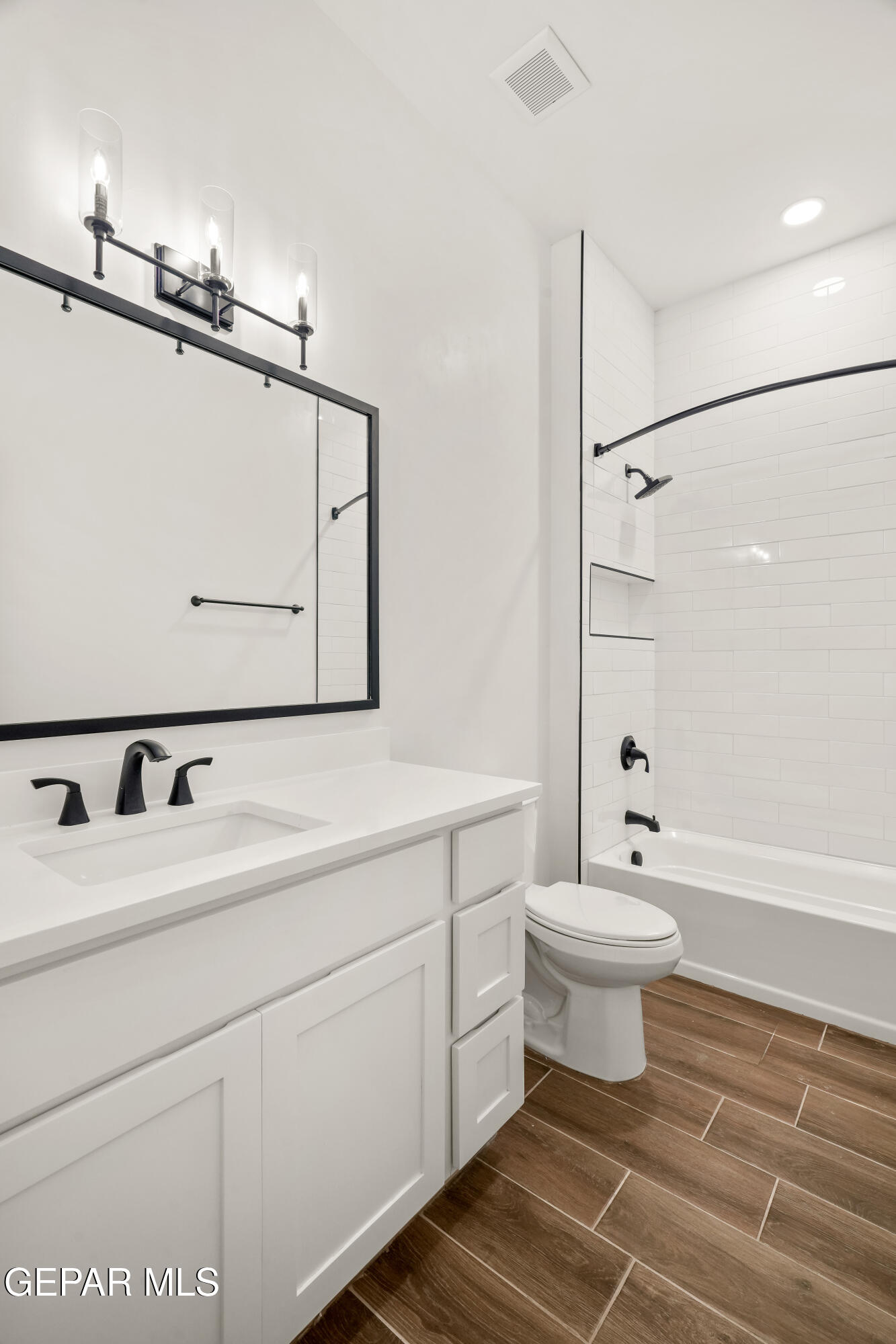 15212 Resolve Drive El Paso, TX 79938 - Photo 23 of 35 a bathroom with a sink toilet a mirror and shower