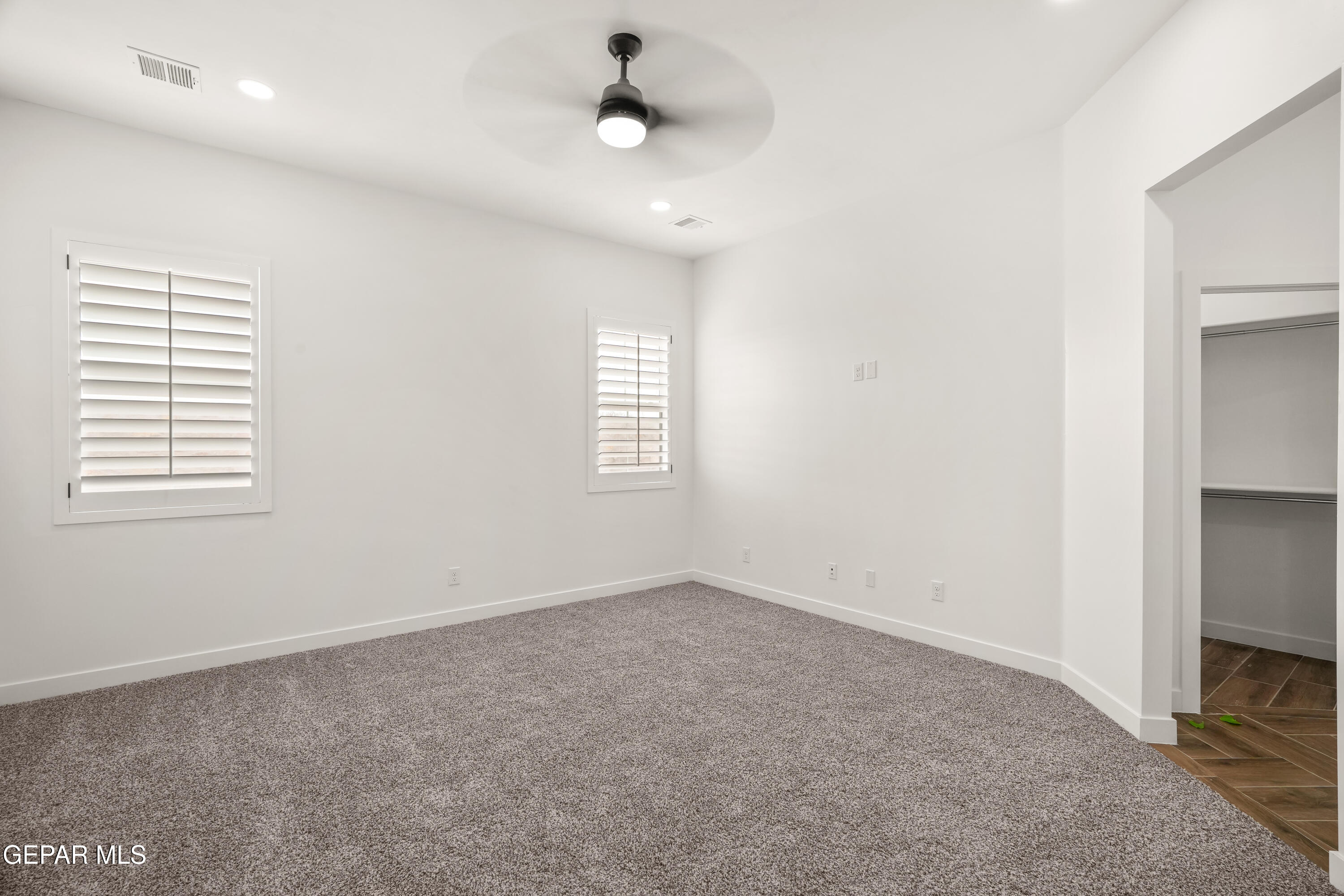 15212 Resolve Drive El Paso, TX 79938 - Photo 26 of 35 an empty room with windows and fan
