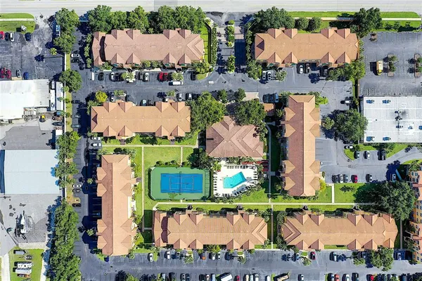 an aerial view of houses with yard