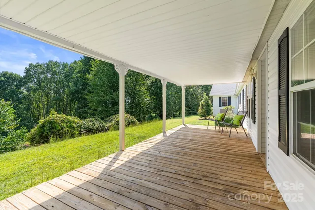 a view of a backyard with sitting area