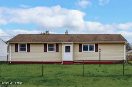 a view of a house with a backyard