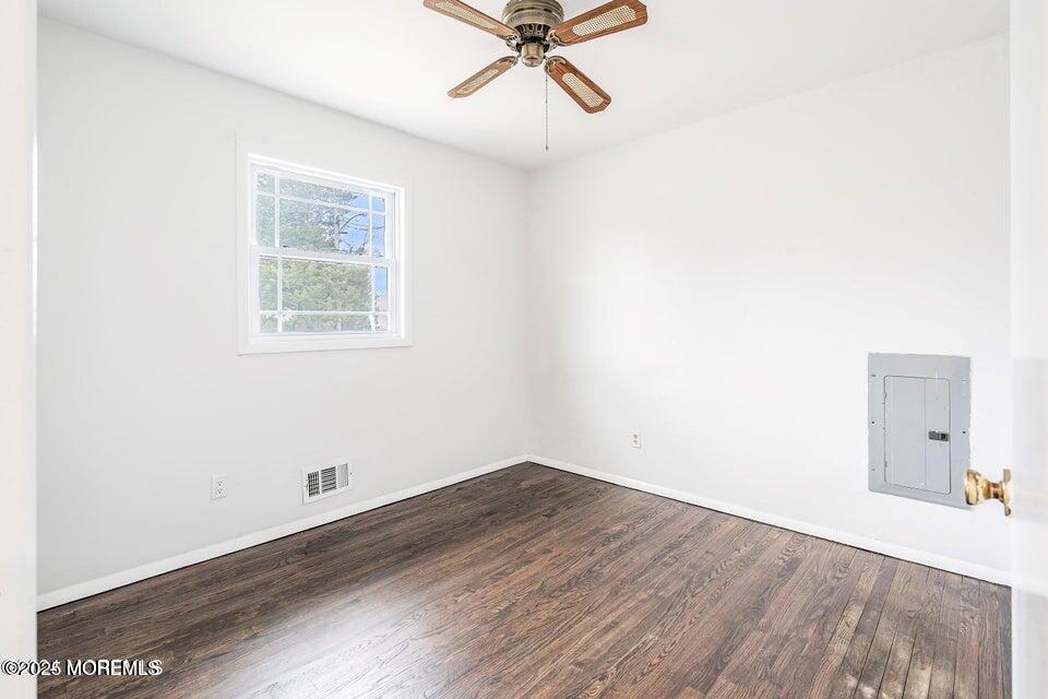 321 Lockheed Road Brick, NJ 08723 - Photo 12 of 16 a view of a room with wooden floor and a ceiling fan