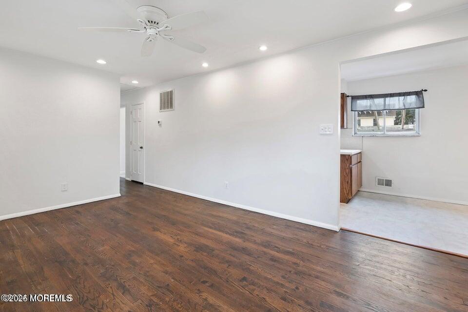 321 Lockheed Road Brick, NJ 08723 - Photo 4 of 16 an empty room with wooden floor and windows