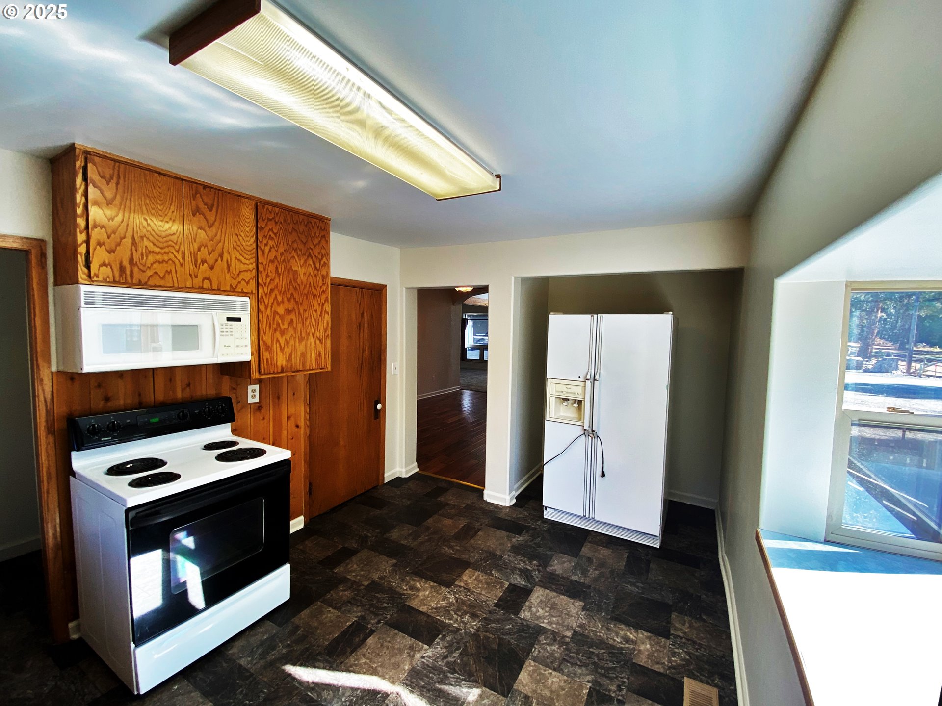 379 Mill Street Sumpter, OR 97877 - Photo 13 of 17 a bedroom with a bed and a window