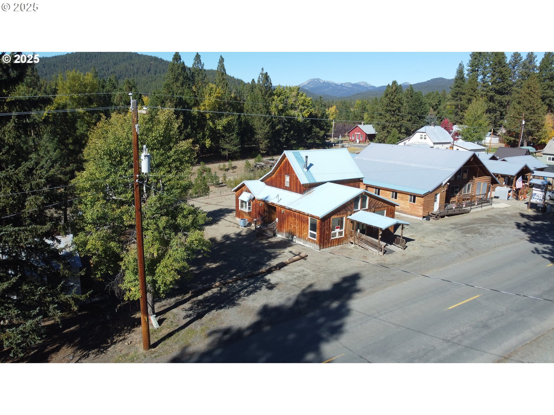 379 Mill Street Sumpter, OR 97877 - Photo 2 of 17 a backyard of a house with table and chairs