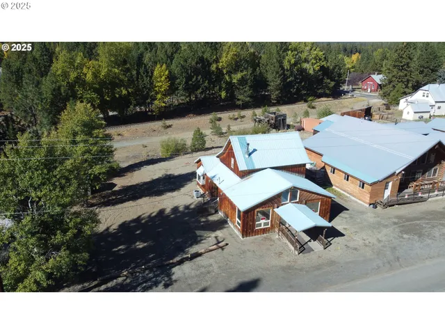 a backyard of a house with yard and trampoline