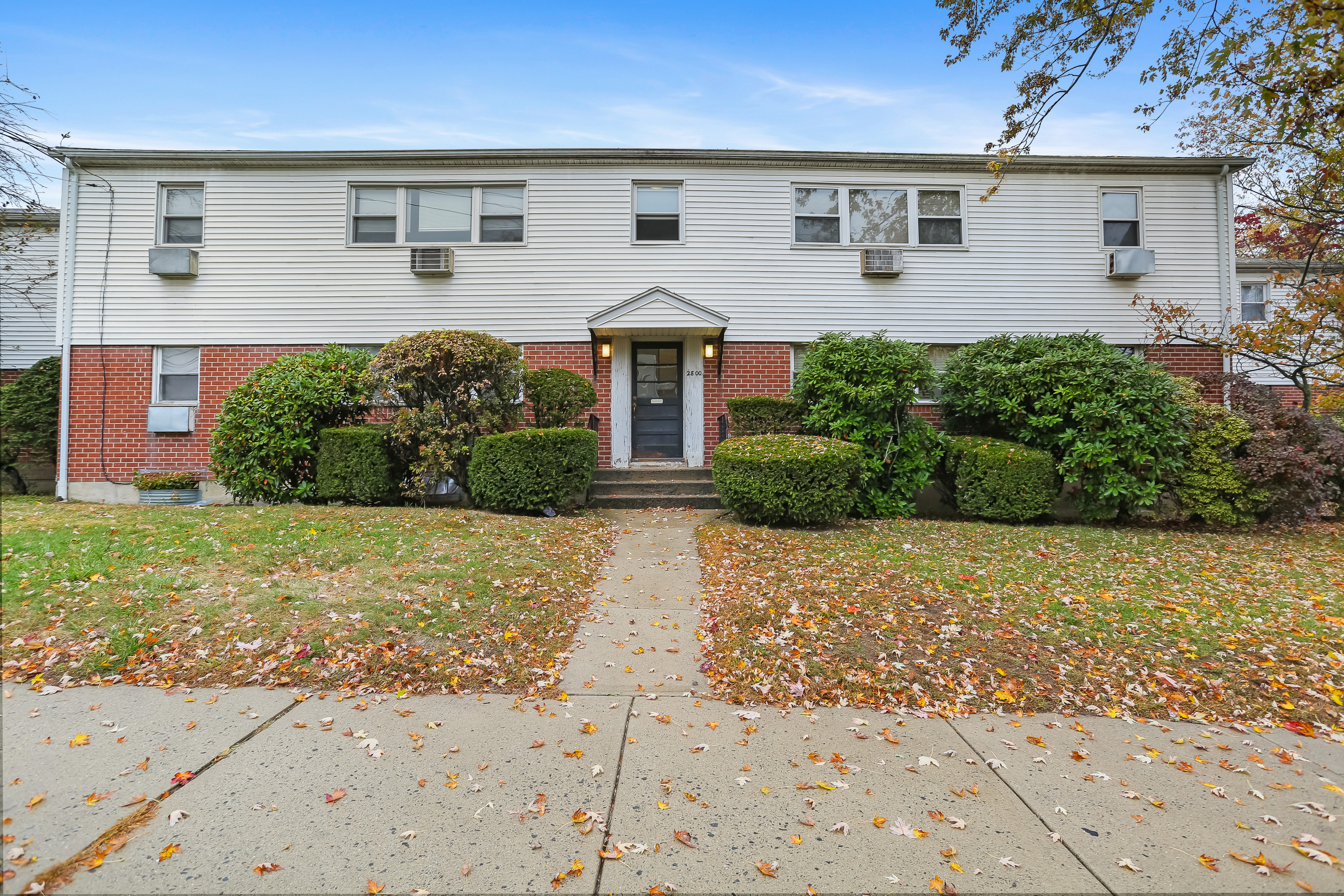 2800 Madison Avenue, Unit 1B Bridgeport, CT 06606 - Photo 1 of 10 front view of a house with a yard