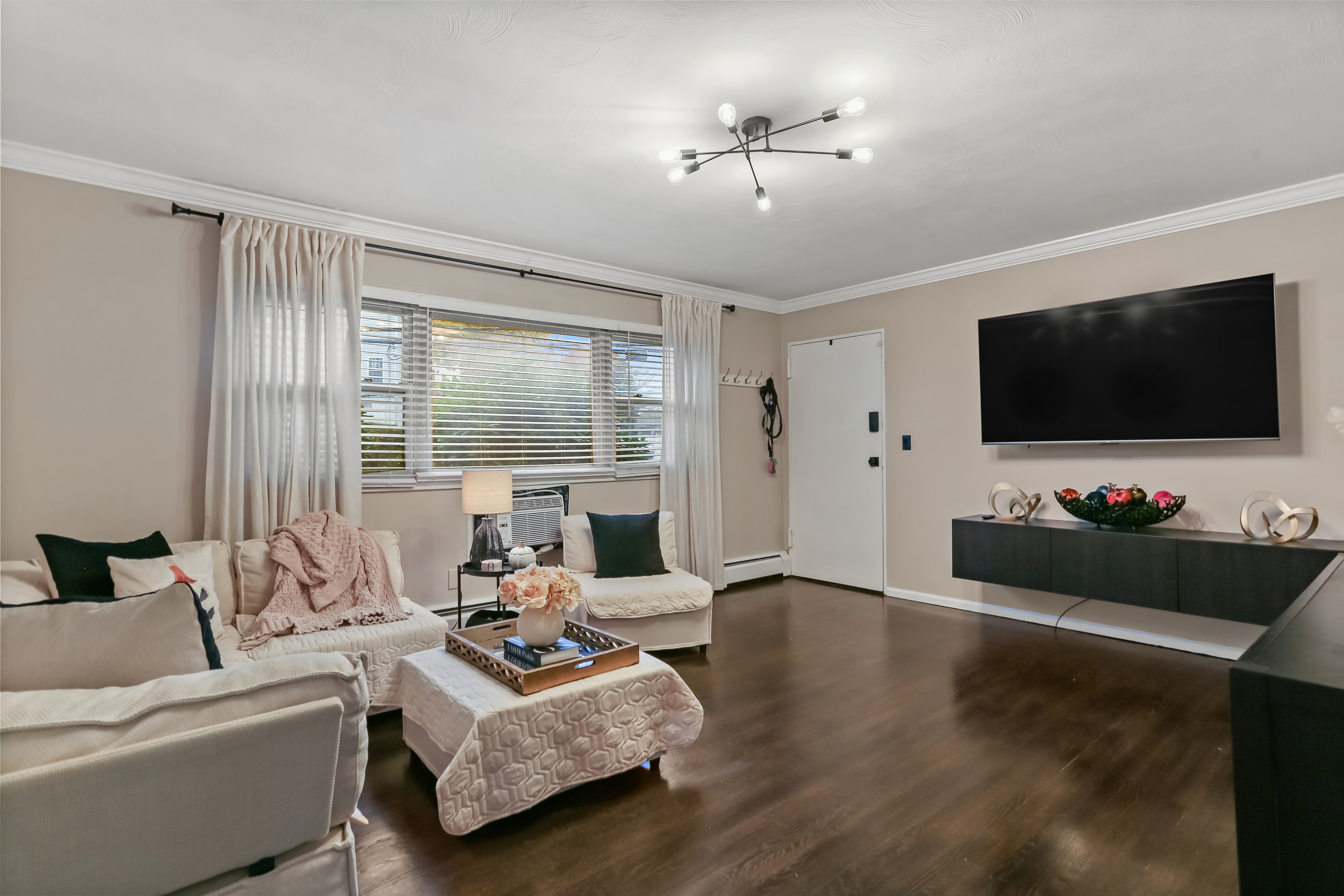 2800 Madison Avenue, Unit 1B Bridgeport, CT 06606 - Photo 5 of 10 a living room with furniture and a flat screen tv