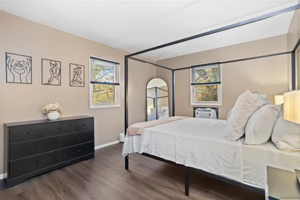 a bedroom with a bed and window