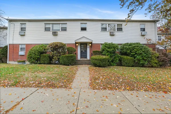 front view of a house with a yard