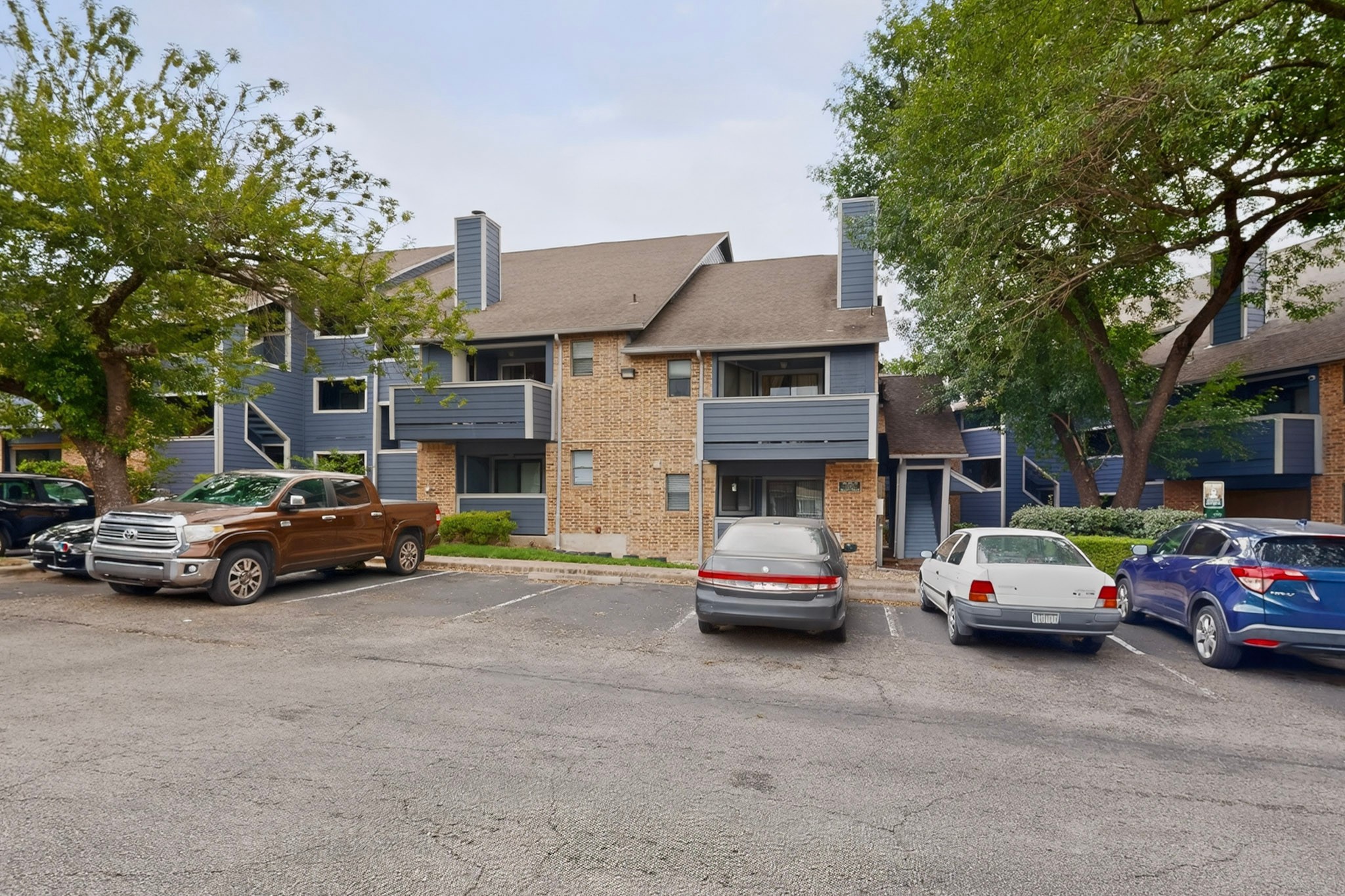 2500 Burleson Road, Unit 506 Austin, TX 78741 - Photo 3 of 23 a view of a cars parked in front of a house