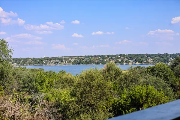 a view of a lake with houses in the background
