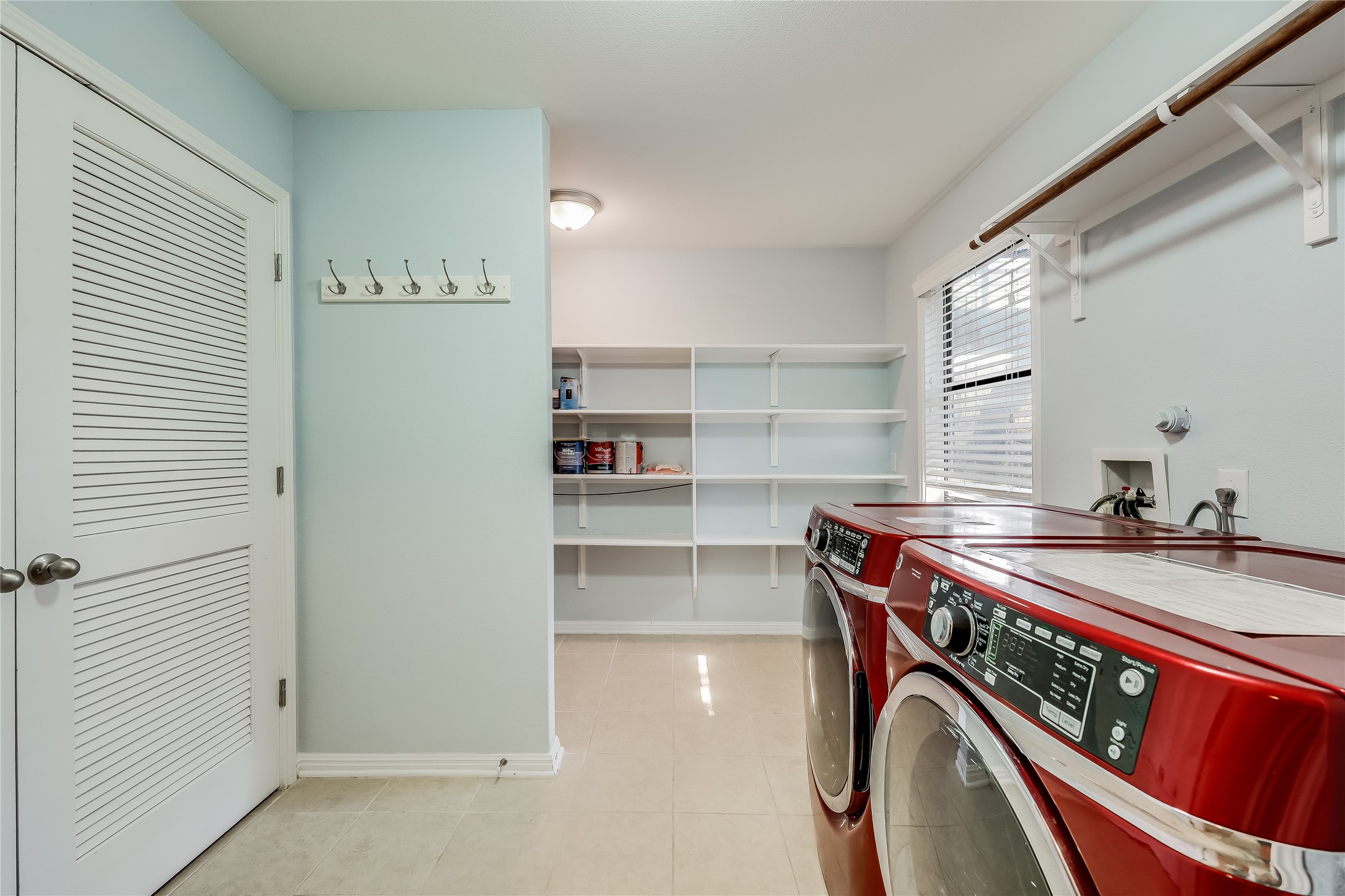 105 Comanche Drive Point Venture, TX 78645 - Photo 28 of 31 Lower level laundry with tons of storage