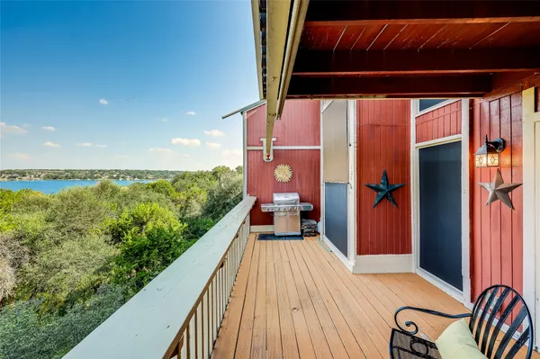 a view of balcony with furniture