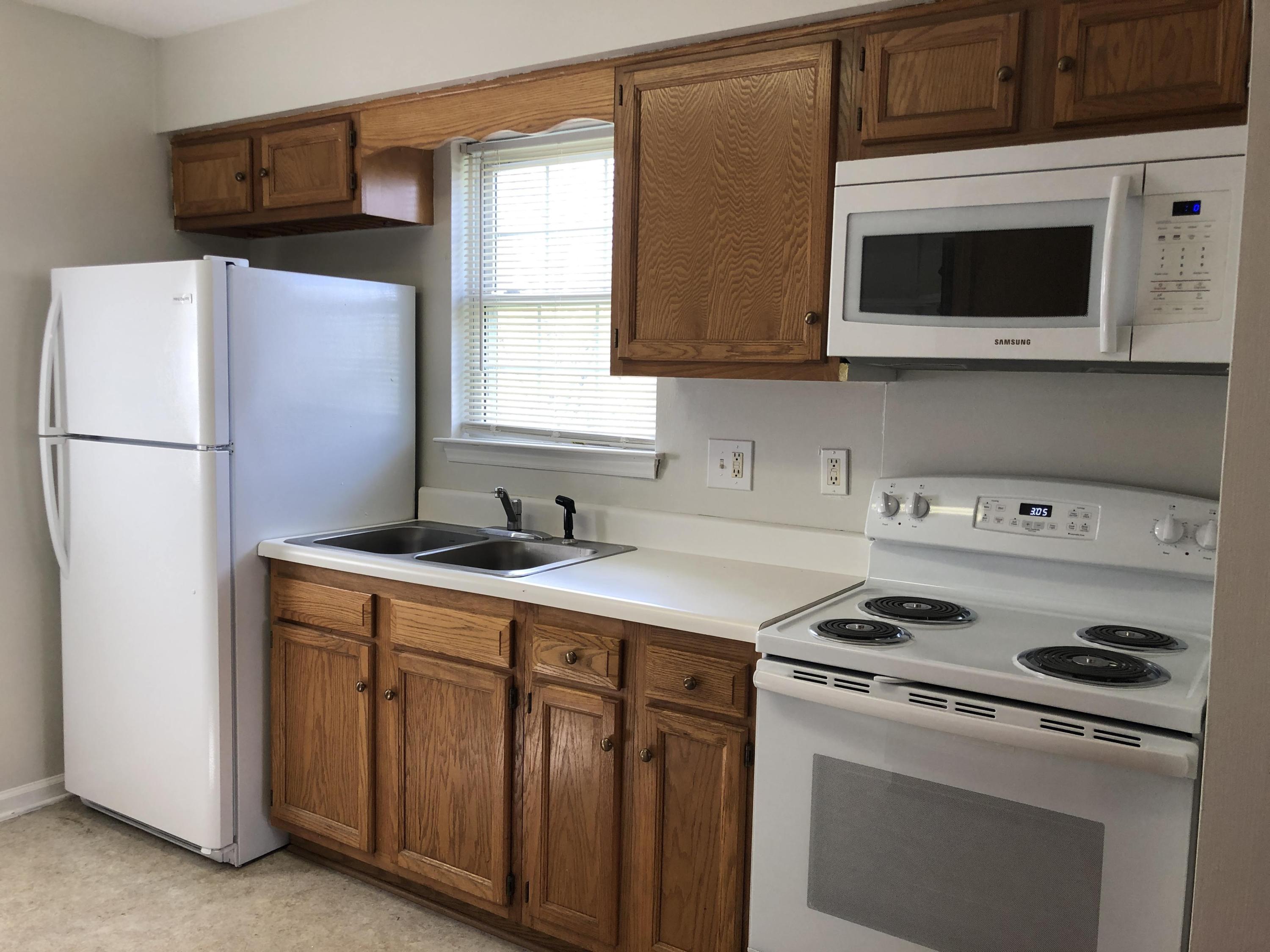 1525 Riverside Terrace Southeast Roanoke, VA 24014 - Photo 14 of 32 a kitchen with a stove and a microwave