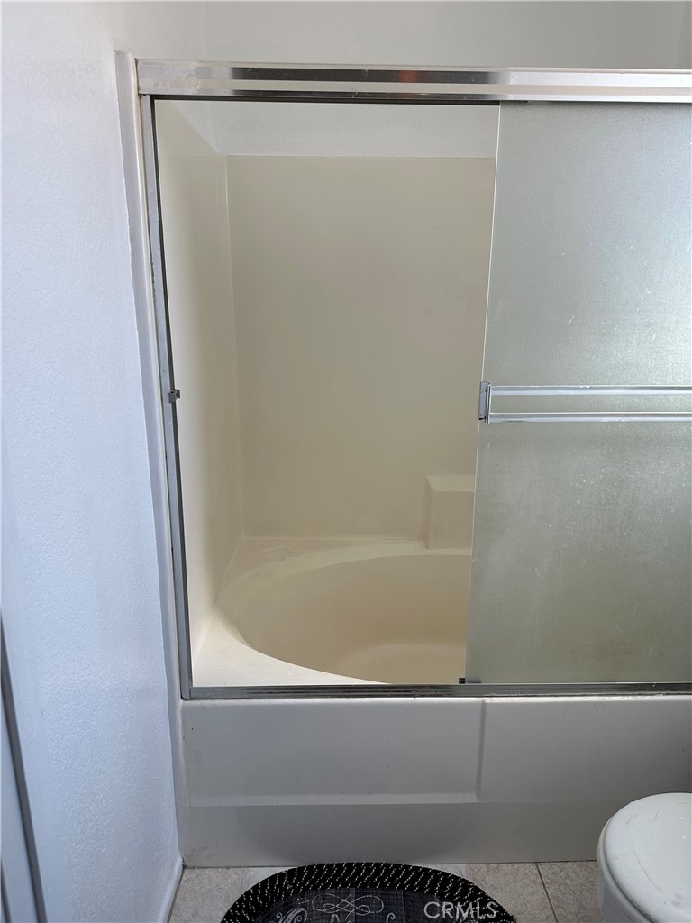 37923 Amethyst Street Palmdale, CA 93552 - Photo 20 of 34 a bathroom with a shower and a toilet