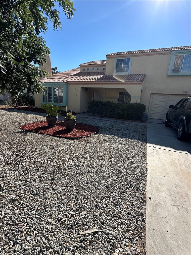37923 Amethyst Street Palmdale, CA 93552 - Photo 2 of 34 a view of a terrace with a bench