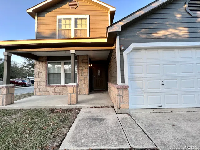 a front view of a house with a outdoor space