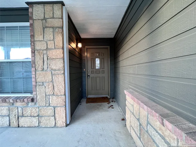 a view of a brick house with an outdoor space