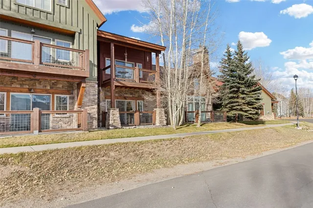 a front view of a building with a garden