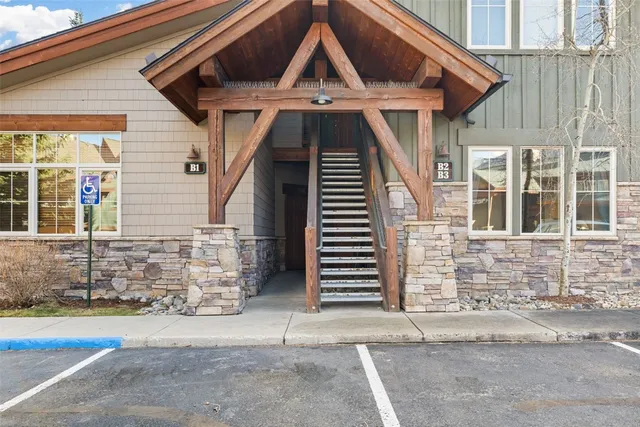 a view of a house with wooden fence