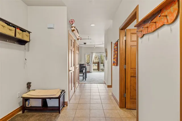 a lobby with furniture and a mirror