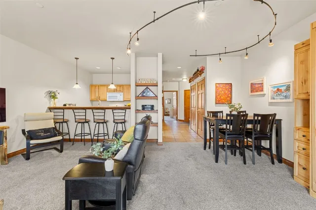 a dining room with furniture water view and a chandelier
