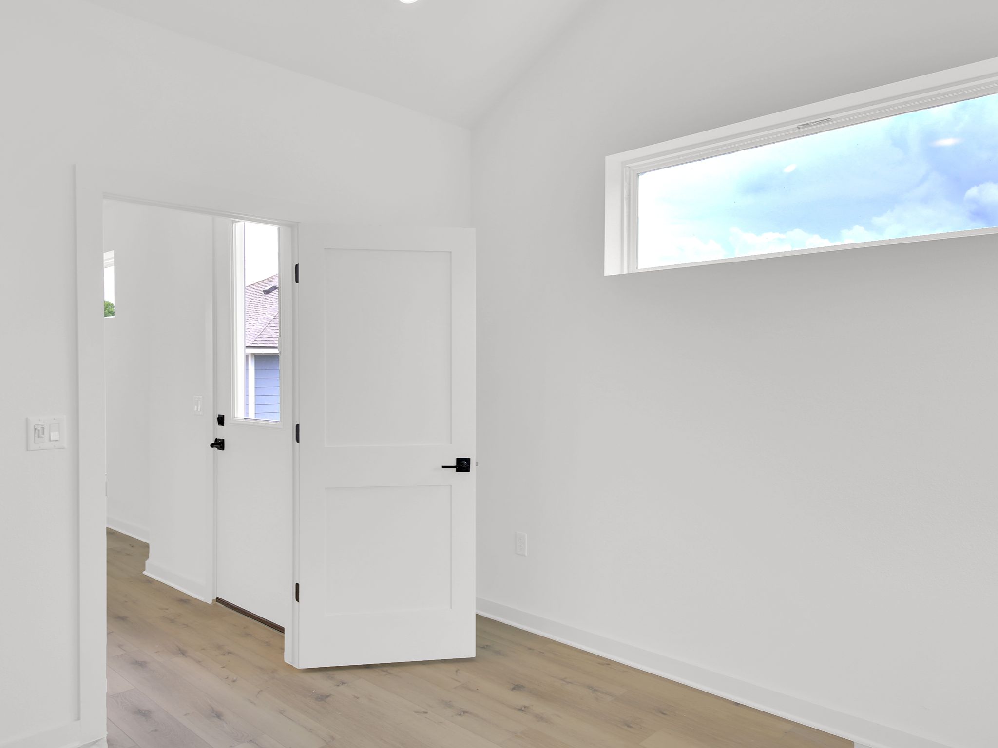 7208 Providence Avenue, Unit 3B Austin, TX 78752 - Photo 2 of 5 Bedroom, separated from the living/kitchen/bath, by a privacy door. That door on the right is the entrance door from the outside.