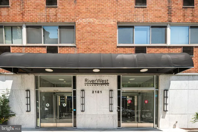 a view of a building with a door and a refrigerator