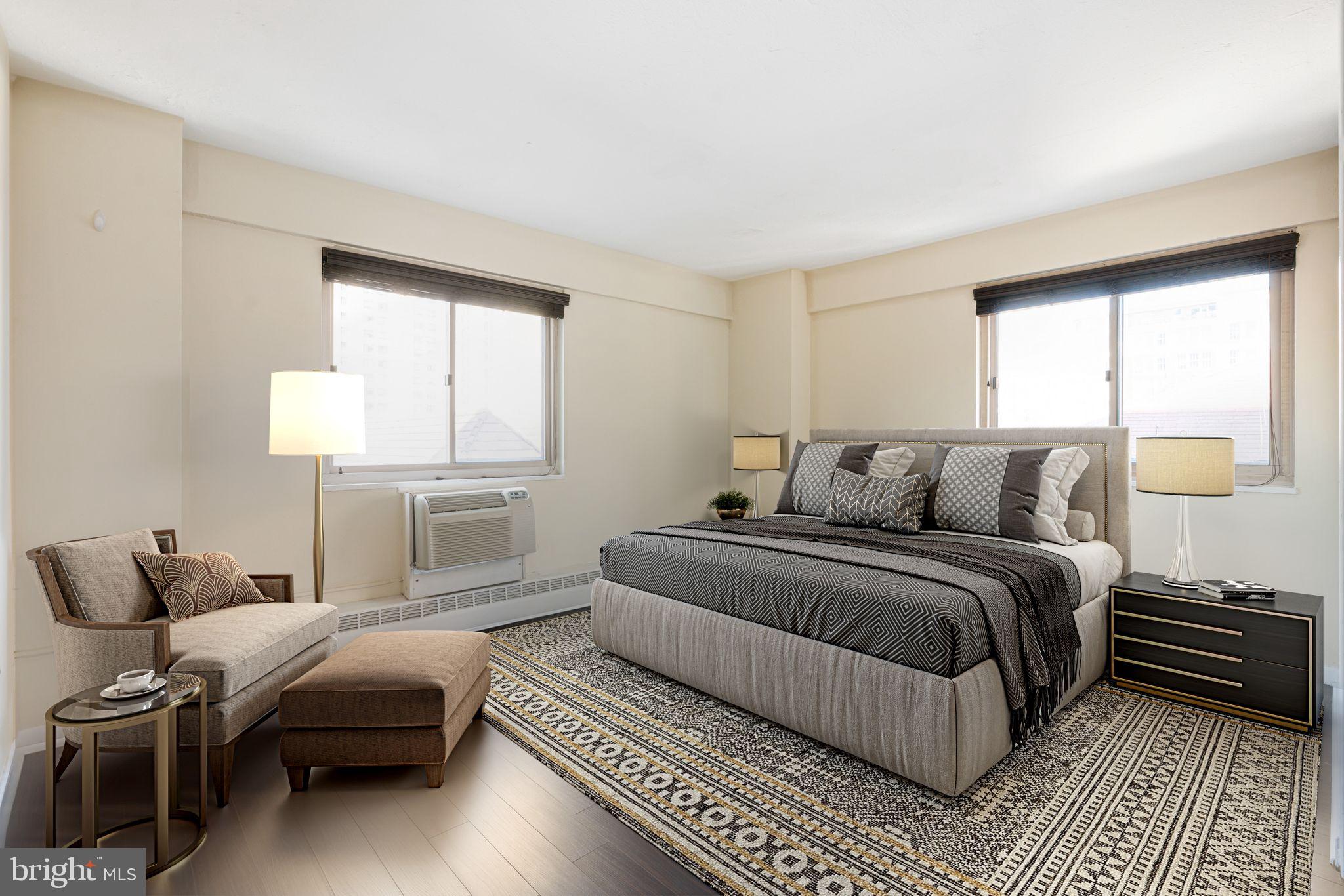 2101 Chestnut Street, Unit 518 Philadelphia, PA 19103 - Photo 8 of 14 a bedroom with a bed and wooden floor