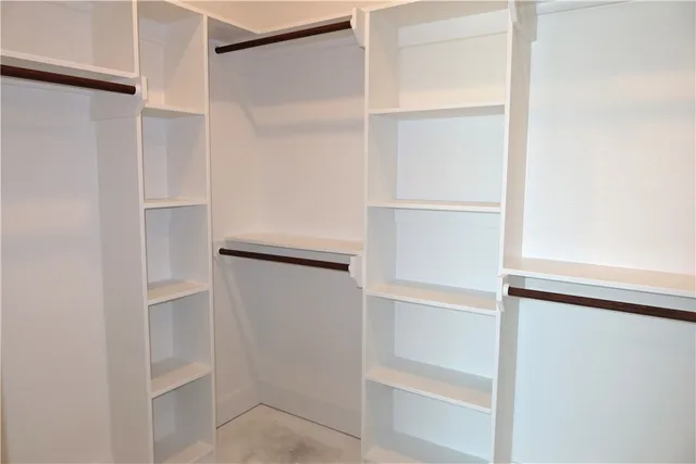 a view of an empty walk in closet