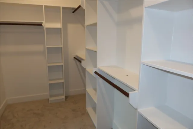 a bathroom with a double vanity sink and mirror