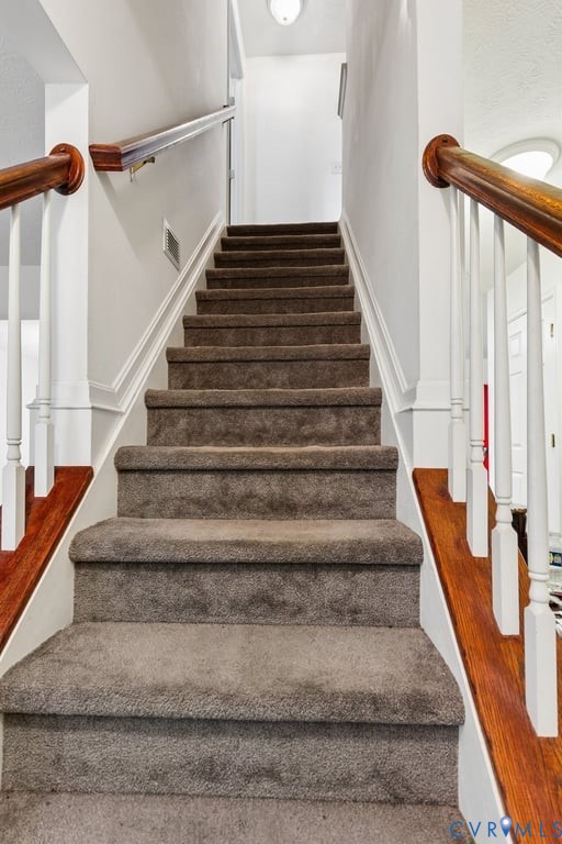 83 Albertson Court Ruther Glen, VA 22546 - Photo 25 of 25 Carpeted staircase featuring white balusters and w