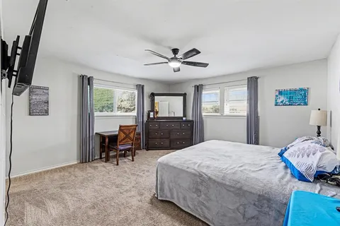 a bedroom with a bed furniture and a window
