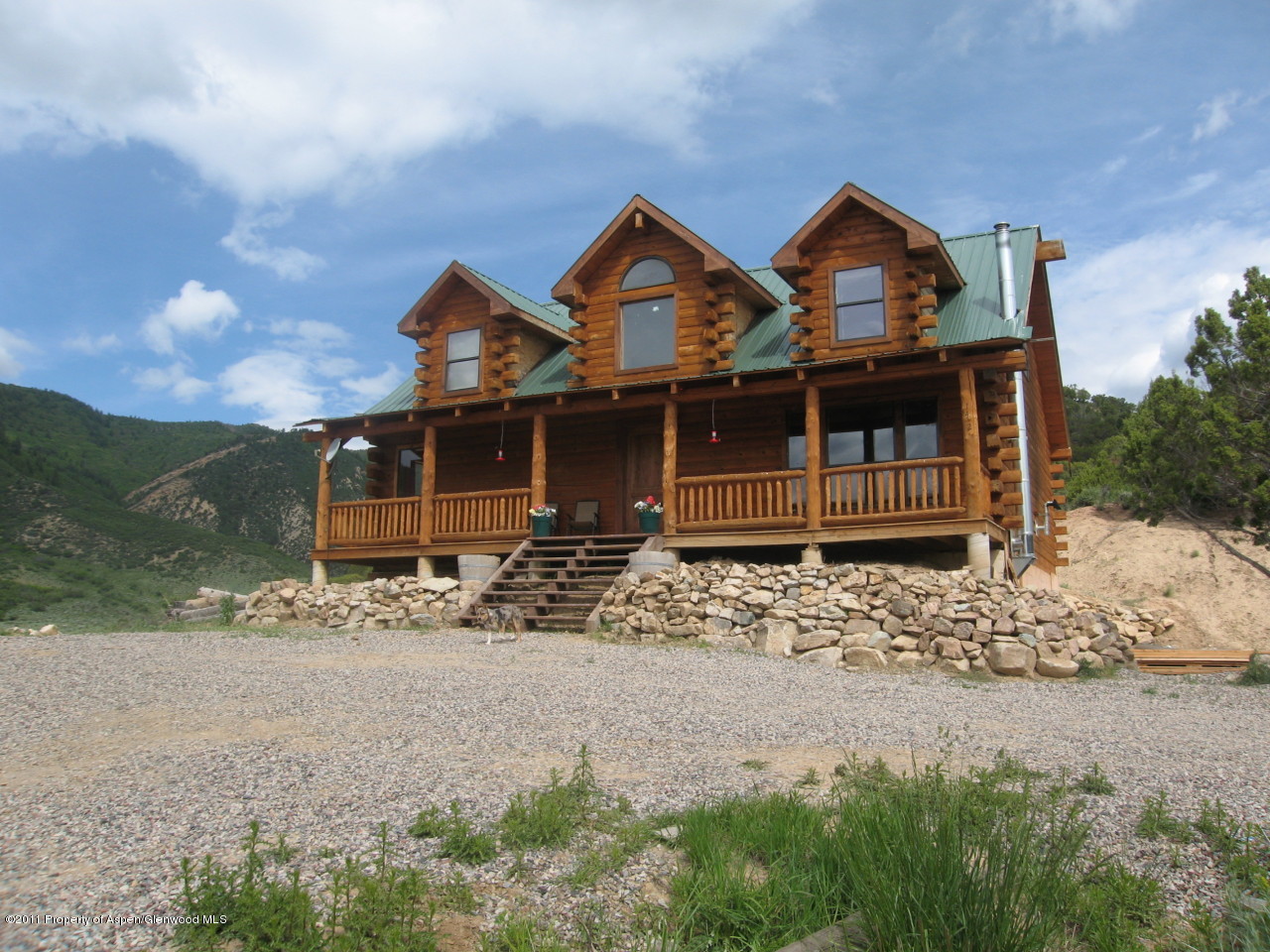 142 Jensen Lane Rifle, CO 81650 - Photo 2 of 11 front view of a house with a yard