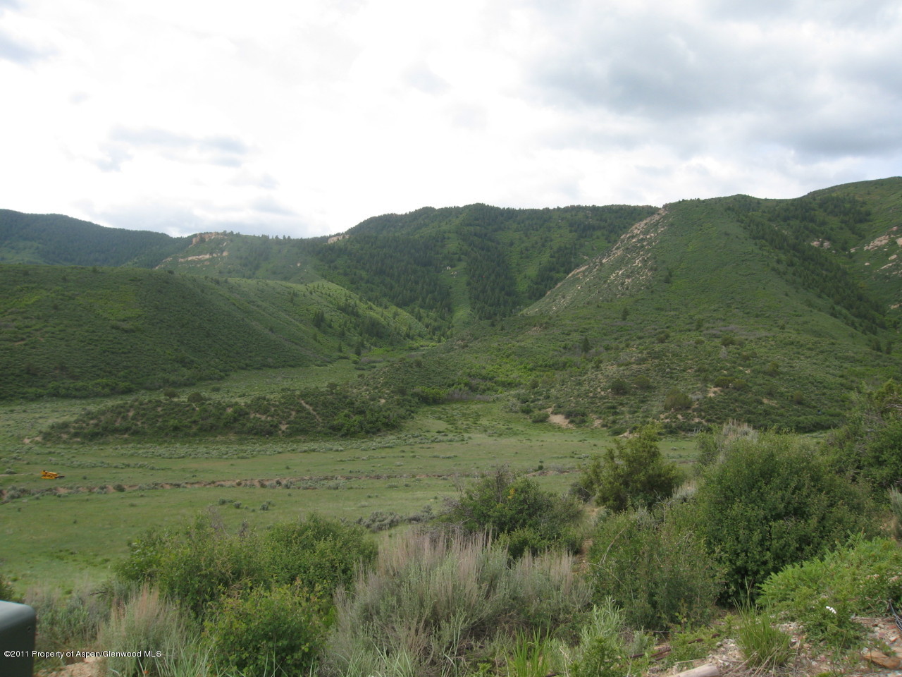 142 Jensen Lane Rifle, CO 81650 - Photo 4 of 11 a view of a lush green field
