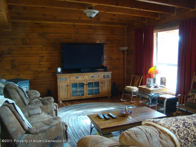 142 Jensen Lane Rifle, CO 81650 - Photo 6 of 11 a living room with furniture and a fireplace