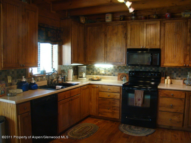 142 Jensen Lane Rifle, CO 81650 - Photo 7 of 11 a kitchen with a sink stove and cabinets