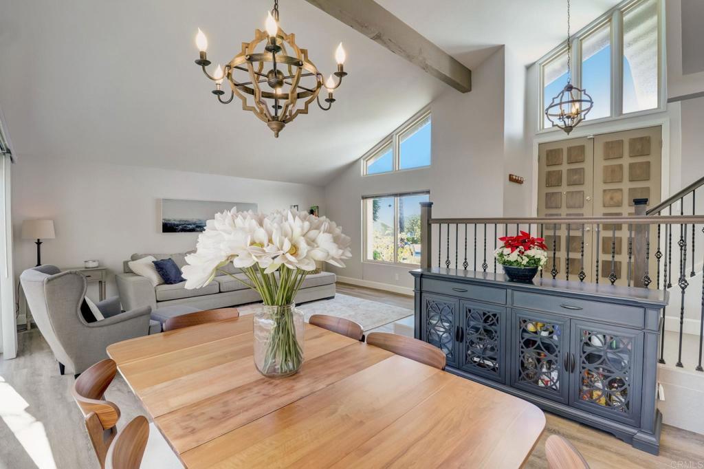 a living room with furniture flowerpot and wooden floor