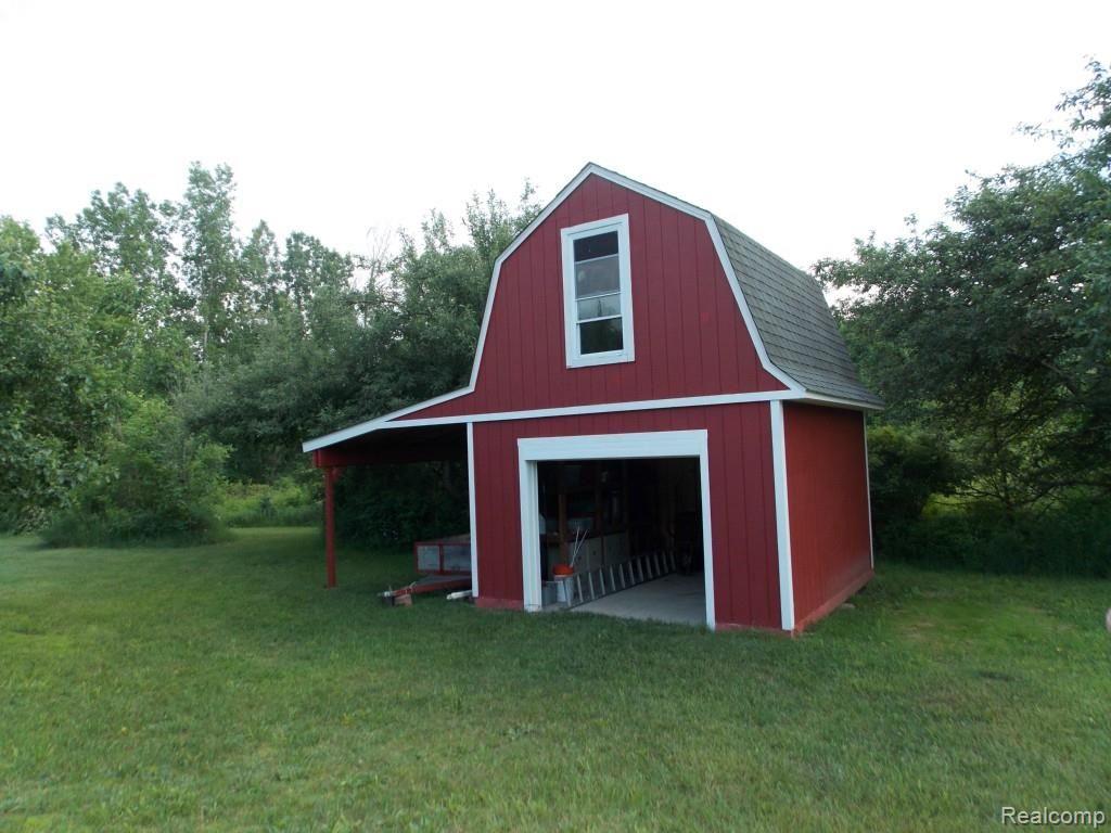 2974 Hannan Road Imlay City, MI 48444 - Photo 40 of 45 The 2 story shed will store your exterior maintance items. The 2nd floor has an exterior stairway on the back of the shed and can be used as a playhouse, or deer blind overlooking the property to the west of the home.