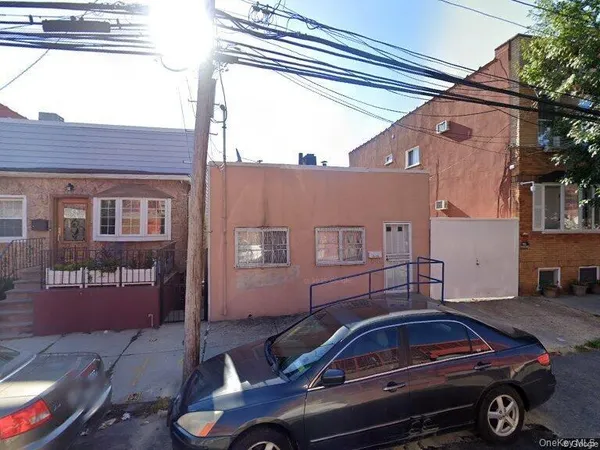 a front view of a house with parking space