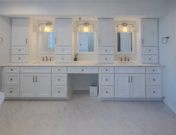 a spacious bathroom with a granite countertop sink and a mirror
