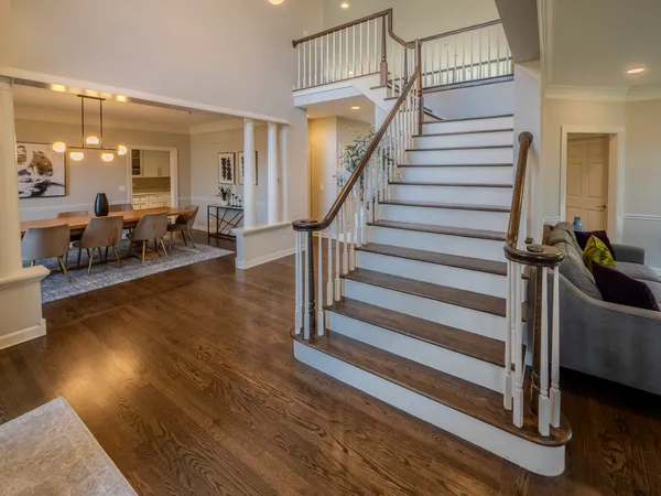 a view of entryway livingroom and hall with wooden floor
