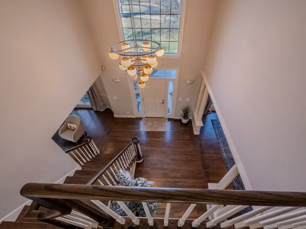 a view of an entryway with wooden floor