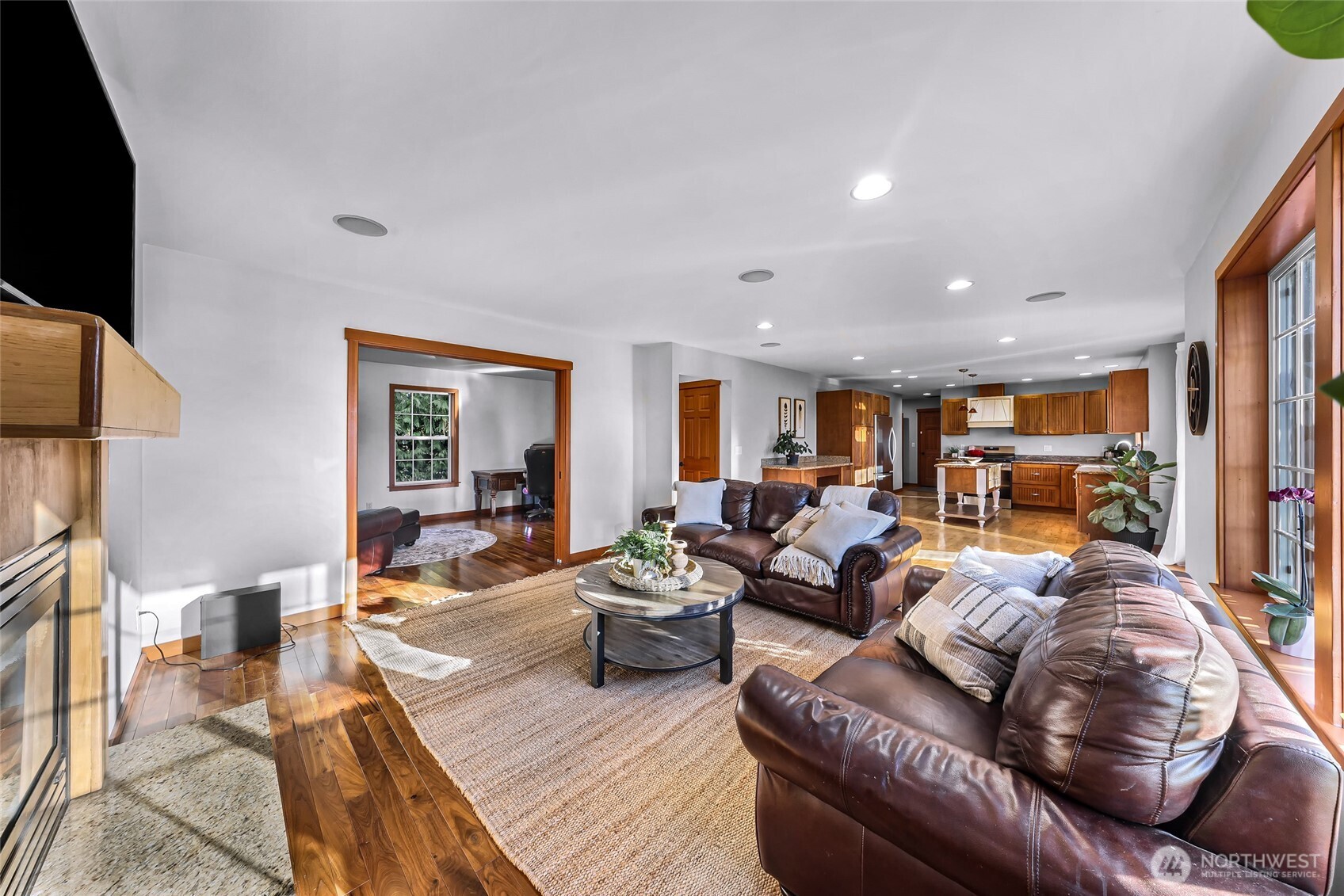 3395 Mack Road Everson, WA 98247 - Photo 15 of 39 a living room with furniture and a flat screen tv