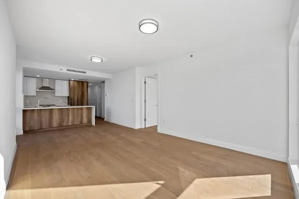 a view of a kitchen with a sink and cabinets