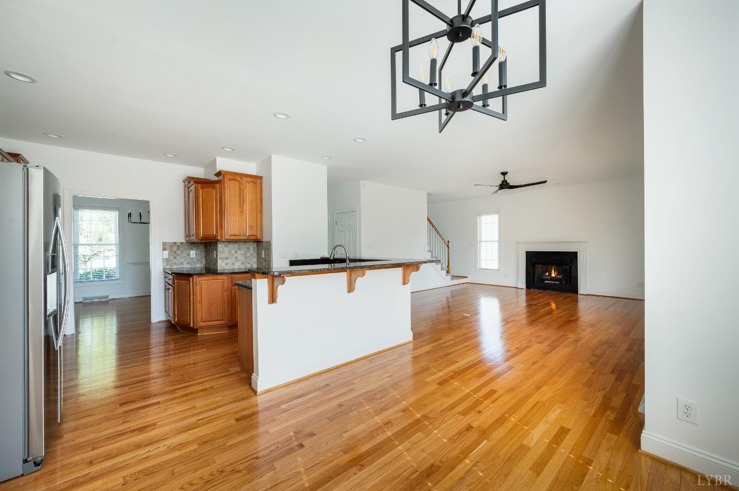 1166 Caperton Way Forest, VA 24551 - Photo 17 of 59 a view of a room with wooden floor and a chandelier