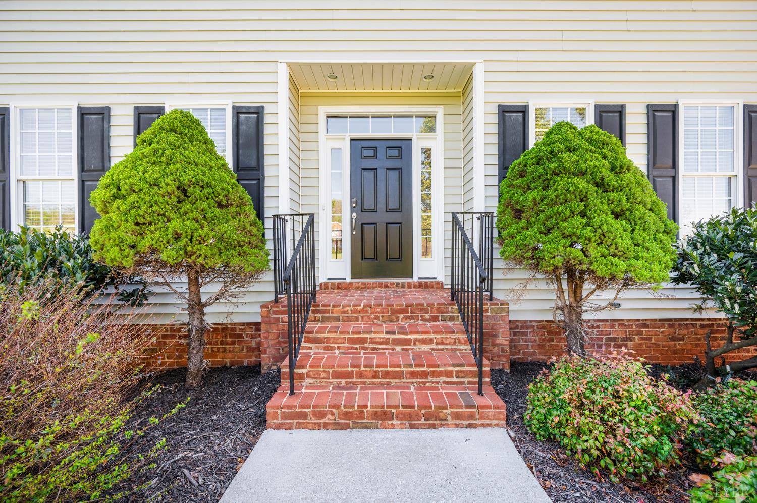 1166 Caperton Way Forest, VA 24551 - Photo 2 of 59 front view of a house with a yard