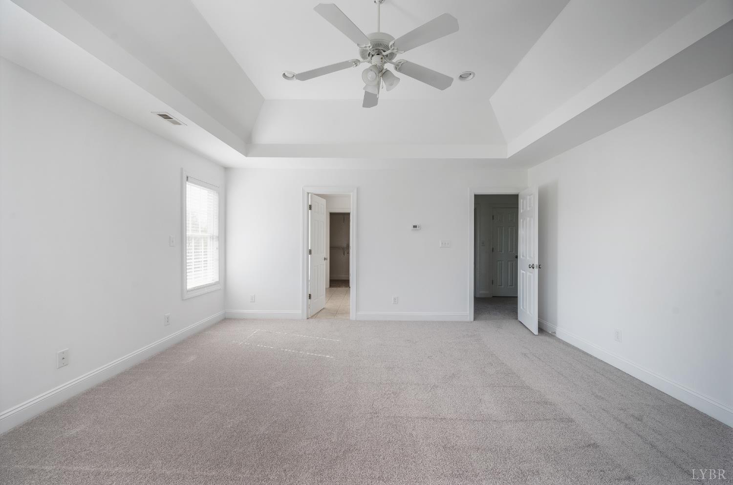 1166 Caperton Way Forest, VA 24551 - Photo 27 of 59 an empty room with a ceiling fan and a window